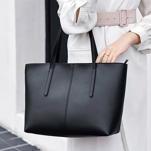 Classic black leather tote bag with large capacity, ideal for professional office commute