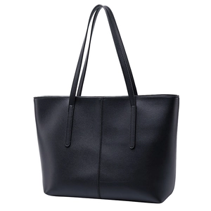 Minimalist black leather tote bag with vertical stitching and long shoulder straps