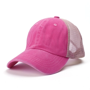 Detail of pink washed cotton and khaki mesh trucker hat with durable stitching