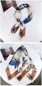Detail of silk square scarf with equestrian horse prints and elegant French style bow motifs
