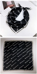 Detail of silk square scarf with black and white letter print and smooth texture
