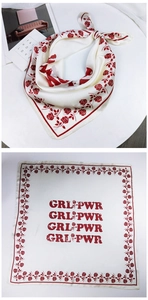 Detailed view of square silk scarf with red rose pattern and GRL PWR print