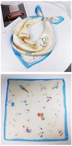 Detail of French printed square silk scarf with blue border and Eiffel Tower patterns