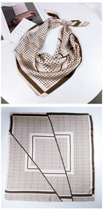 Detail of square silk scarf with beige and olive green dot pattern in a stylish knot
