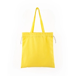 Detail view of yellow canvas tote bag with beige drawstring closure on white background