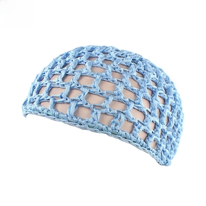 Detailed close-up of sky blue hand-crocheted hairnet showing diamond mesh pattern