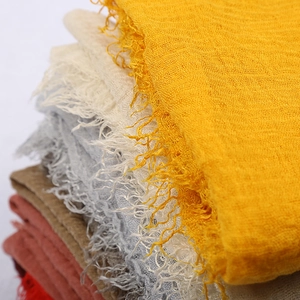 Solid color voile scarves with crinkle texture and fringe edges in multiple colors