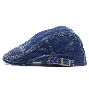 Classic dark blue washed denim beret with brass adjustment buckle and orange stitching