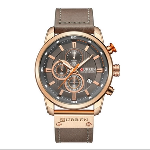 Macro detail of Curren men's chronograph watch with rose gold case and gray dial