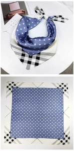 Detailed view of square silk scarf featuring lavender polka dots and classic plaid patterns
