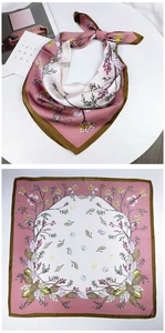 Detail of silk square scarf featuring elegant floral berry print and green stitched edges