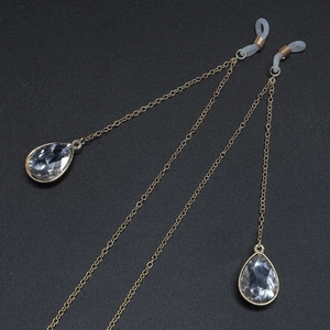 Golden eyewear chain with anti-slip rubber loops and teardrop crystal pendants