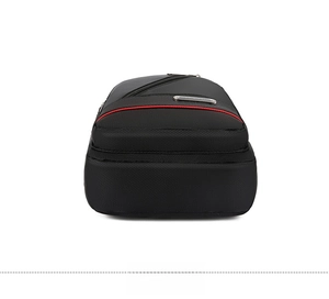 Detailed bottom view of black waterproof oxford fabric chest bag with red zipper accent