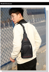 Detail of waterproof Oxford cloth sling bag featuring multiple zippers and red accent lines