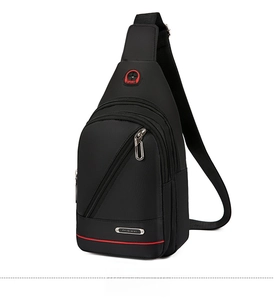 Detail view of black oxford chest bag with red earphone hole and dual zipper pockets