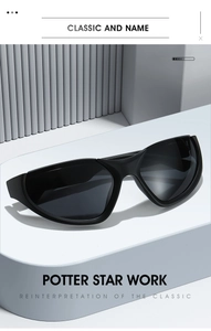 Detail of matte black wrap-around sports sunglasses with streamlined one-piece lens