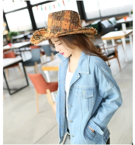 Brown and orange patchwork wide-brim cowboy hat with light blue denim jacket outfit