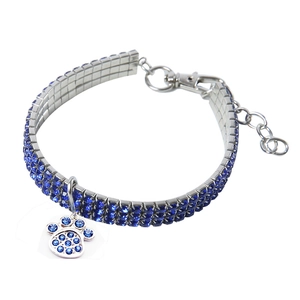 Macro view of blue rhinestone pet collar with claw pendant and adjustable silver chain
