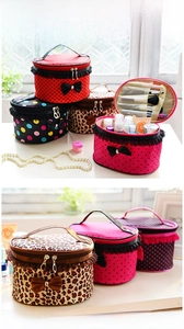 Detail showing waterproof cosmetic bag interior with brush slots and lace bow design