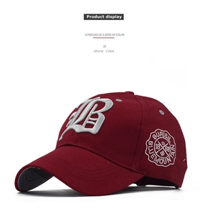 Macro detail of wine red cotton baseball cap with 3D letter B and round logo embroidery