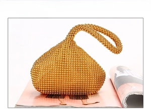 Front view of a gold triangular evening clutch bag with sparkling rhinestone embellishments