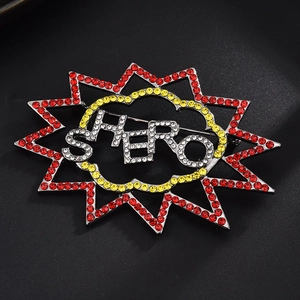 Sparkling crystal 'HERO' brooch in comic speech bubble shape with red and yellow rhinestones