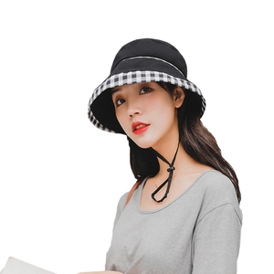 Women's black cotton bucket hat with checkerboard brim and adjustable windproof cord
