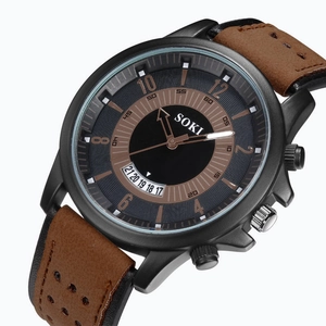 Close-up of SOKI men's watch with black dial, bronze numerals, and brown leather strap