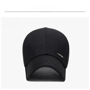 Front view of black mesh sport cap featuring a refined silver metal logo plate