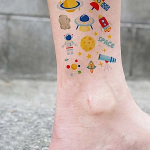 Cartoon space exploration temporary tattoos for kids featuring astronauts and planets