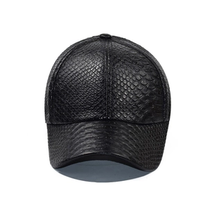 Detail of black faux snakeskin leather baseball cap featuring 3D embossed python texture