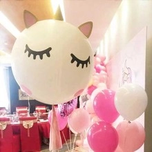 Unicorn shaped foil balloon in white and gold for festive party decoration setup