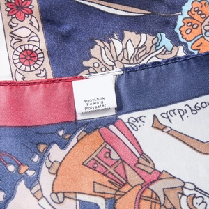 Detailed close-up of 100% silk feeling polyester label and high-quality printed fabric edge