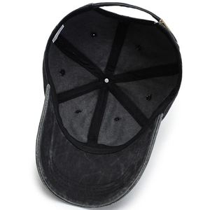 Interior view of black washed cotton baseball cap with adjustable metal buckle strap