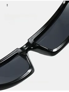 Detail shot of ergonomic integrated nose pads on black sports sunglasses for comfort