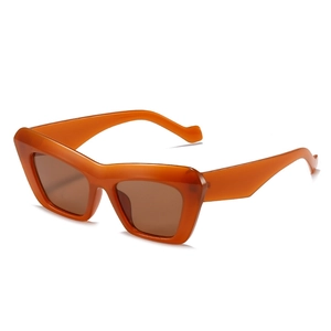 Fashionable orange cat eye sunglasses with translucent frames and brown lenses for women