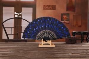 Detail of royal blue sequin peacock embroidery and gold lace on folding fan