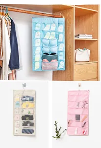 Detail view of hanging storage bag with mesh pockets in blue, beige, and pink colors