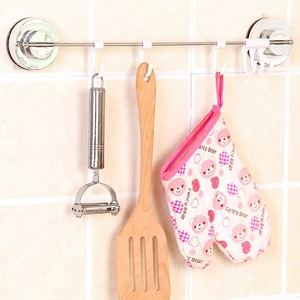 Wall-mounted stainless steel rack with hooks featuring a multi-functional fruit peeler