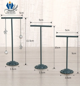 Three-piece metal T-bar earring display stands with ornate bases and height dimensions