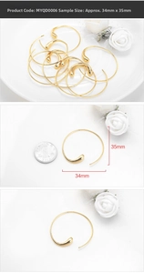 Detailed view of large gold-tone teardrop hoop earrings showing 35mm dimensions and texture