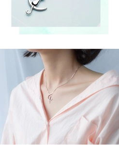 Close-up and lifestyle view of a silver cat and moon pendant necklace for women