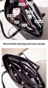 Detailed interior of a black leather tote showing 6 compartments for a 10-inch iPad and A4