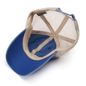 Detail view of cotton washing label and breathable mesh on a vintage baseball cap