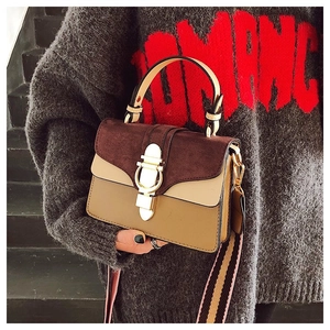Three-tone crossbody bag detail with golden ring lock and matte contrast textures