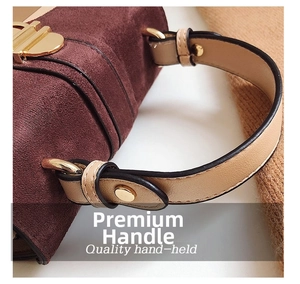 Detailed macro view of the frosted leather texture and high-quality brown handbag handle