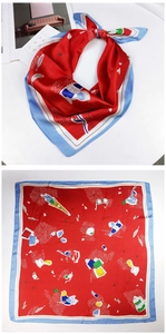 Detail of red silk scarf with wine-themed prints and light blue contrast stitched edges