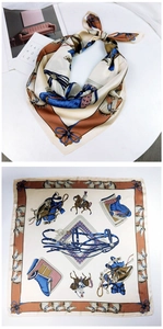 Close-up of silk scarf featuring classic equestrian print and elegant bow details