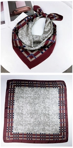 Detailed view of burgundy square silk scarf with marble texture and geometric pattern