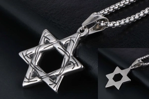 Detailed close-up of hollow hexagram pendant with runic engravings on black leather background